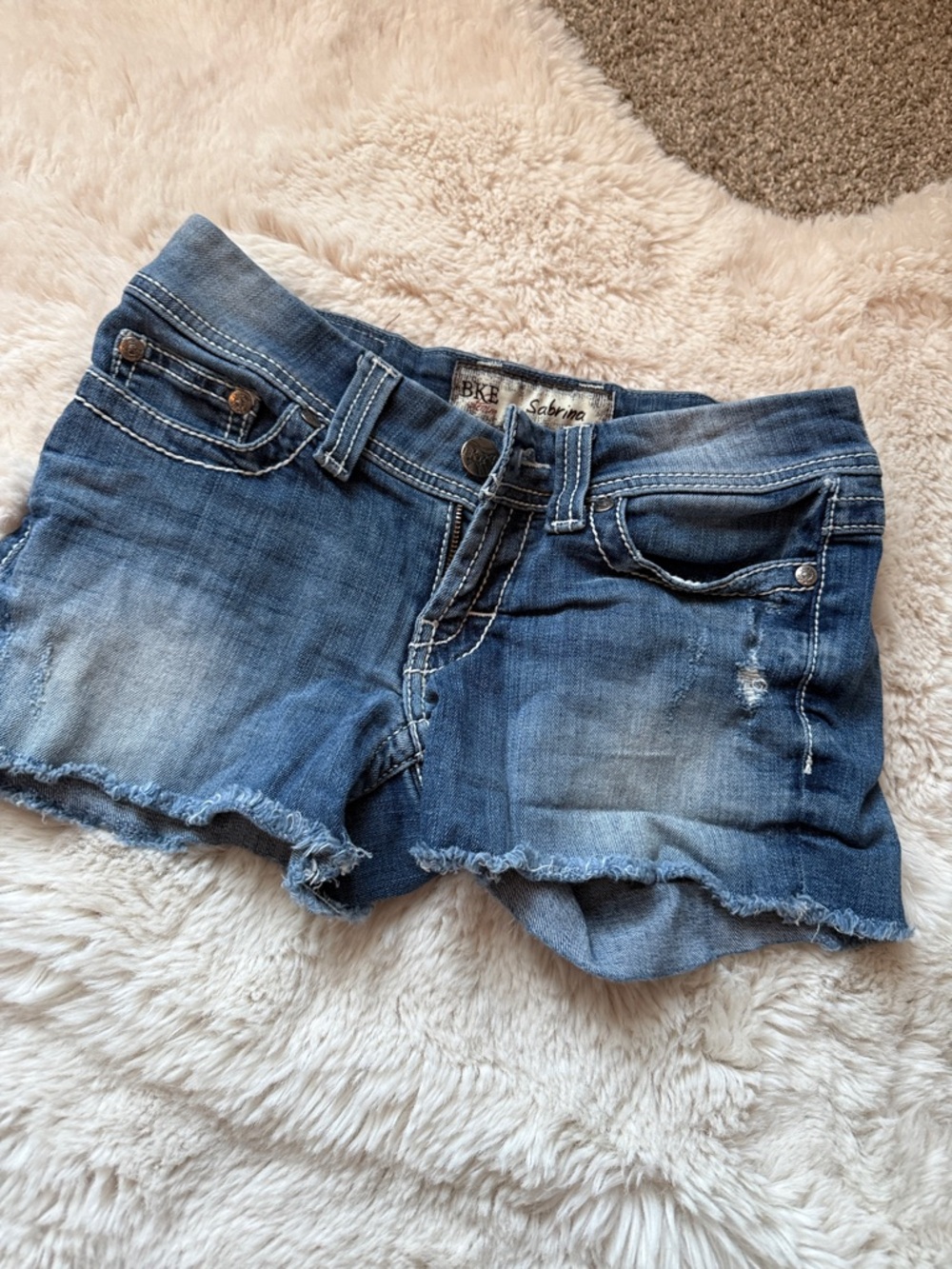 BKE Women's Washed Blue Denim Frayed Hem Shorts